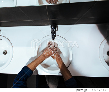 close up. man carefully washes his hands with soap close up. man carefully washes his hands with soap 99267345
