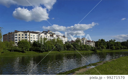summer landscape of a river and low-rise houses in Europe 99271570