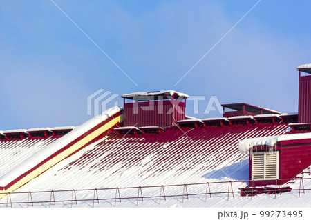 Red roof of a house in the snow. Symbol of the New Year holidays, Christmas and the arrival Red roof of a house in the snow. Symbol of the New Year holidays, Christmas and the arrival 99273495