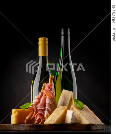 Antipasto board with various cheese and snacks Antipasto board with various cheese and snacks 99275549