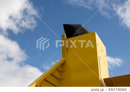 Yellow boat chimney and a cloudy sky Yellow boat chimney and a cloudy sky 99278060