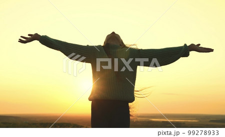 young girl prays looking up sky with her hands up. offer forgiveness, help, confession. man dream.religious girl at sunset. women faith. travel millennial outdoors. girl hair wind rays sun. love life. young girl prays looking up sky with her hands up. offer forgiveness, help, confession. man dream.religious girl at sunset. women faith. travel millennial outdoors. girl hair wind rays sun. love life. 99278933