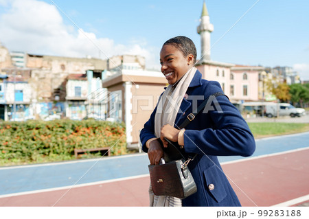 Young urban african woman walking in the city Young urban african woman walking in the city 99283188