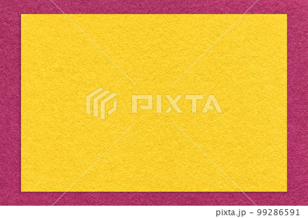 Texture of craft yellow color paper background with purple border, macro. Vintage dense kraft golden cardboard Texture of craft yellow color paper background with purple border, macro. Vintage dense kraft golden cardboard 99286591