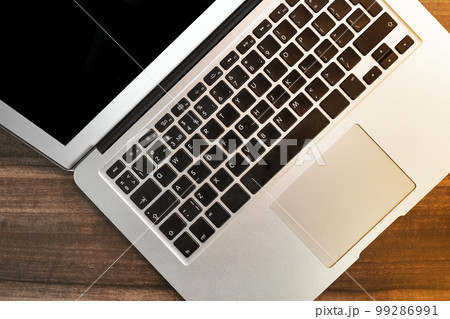 Keyboard laptop table workspace empty workplace job work business blank wooden desk modern background Keyboard laptop table workspace empty workplace job work business blank wooden desk modern background 99286991