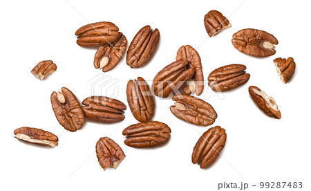 Pecans isolated on white background. Nuts scattered. Top view. Pecans isolated on white background. Nuts scattered. Top view. 99287483