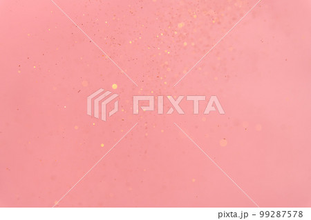 pink abstract background with flying gold sequins pink abstract background with flying gold sequins 99287578