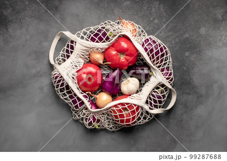 reusable mesh bag for shopping, with fresh vegetables. reusable mesh bag for shopping, with fresh vegetables. 99287688