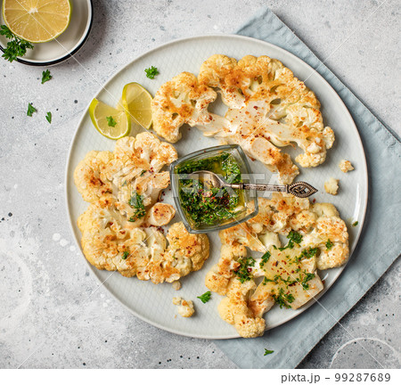 Delicious, healthy baked cauliflower with pesto. Delicious, healthy baked cauliflower with pesto. 99287689