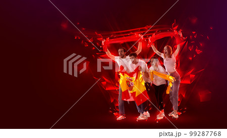 Creative art collage. Modern design. Group of emotional young people actively cheering up favourite spanish football team over red background 99287768
