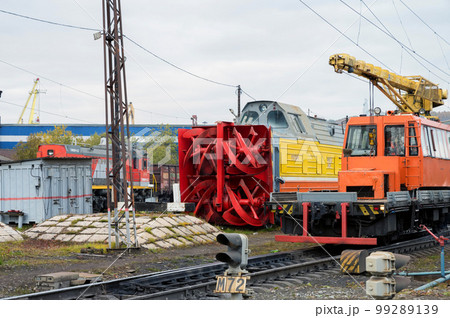 MURMANSK, RUSSIA - SEPTEMBER 17, 2021: Milling-rotary electric snowplow. MURMANSK, RUSSIA - SEPTEMBER 17, 2021: Milling-rotary electric snowplow. 99289139