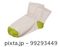 A pair of beige women's socks with green toes and heels, lie one on top of the other, flat lay 99293449