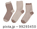 Three pairs of socks, with and without stripes, in a row, on a white background 99293450