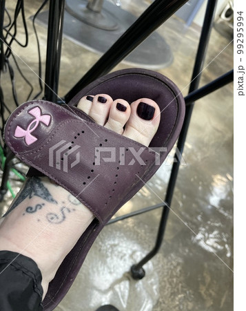 Photo of a foot after and Pedicure purple nail polish Photo of a foot after and Pedicure purple nail polish 99295994