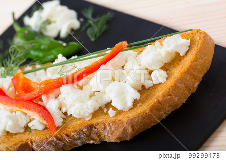 Canape with young cheese and pepper Canape with young cheese and pepper 99299473