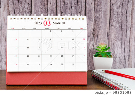 The March 2023 Monthly desk calendar for 2023 year with open diary wooden background. The March 2023 Monthly desk calendar for 2023 year with open diary wooden background. 99301093