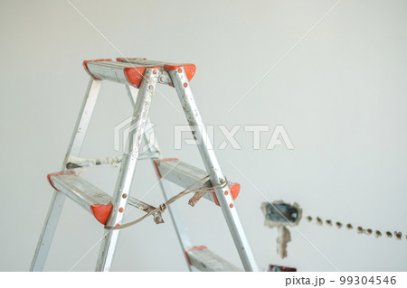 Ladder at construction site building. Renovation, Repair and development of home and apartment concepts 99304546