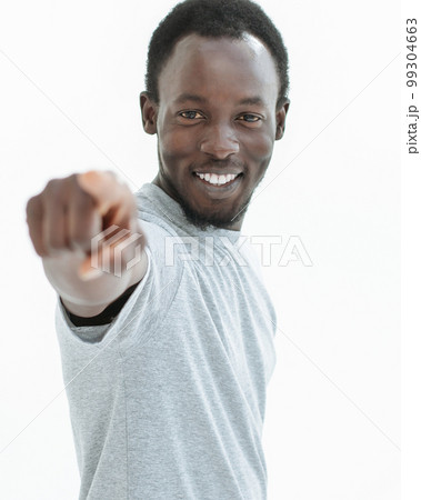 young man in a white t-shirt points at you. 99304663