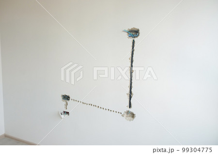 Electrical Wiring under plaster, hidden installation cables for socket to a concrete. Renovation, Repair and development of home and apartment concepts 99304775