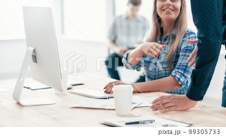 young employees greet each other with a handshake. young employees greet each other with a handshake. 99305733