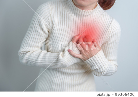 woman hand holding chest ache. Heart disease, angina disease and symptom heart attack disease Cardiovascular, Atherosclerosis, Hypertensive world Heart day and health concept 99306406