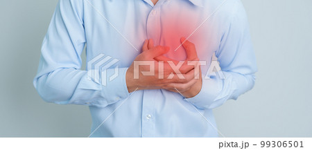 man hand holding chest ache. Heart disease, angina disease and symptom heart attack disease Cardiovascular, Atherosclerosis, Hypertensive world Heart day and health concept man hand holding chest ache. Heart disease, angina disease and symptom heart attack disease Cardiovascular, Atherosclerosis, Hypertensive world Heart day and health concept 99306501