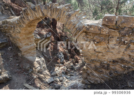 Old Small bridge aqueduct in mountain. More than hundred years ago it was held Golitsyn plumbing. Crimea Old Small bridge aqueduct in mountain. More than hundred years ago it was held Golitsyn plumbing. Crimea 99306936