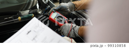 Mechanical service using multimeter to check voltage level in car battery and auto documentation diagram 99310858