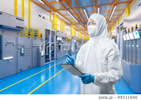 Worker or engineer wears protective suit or coverall suit work in semiconductor manufacturing factory Worker or engineer wears protective suit or coverall suit work in semiconductor manufacturing factory 99311666