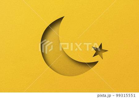 yellow paper cut into holes The crescent moon is overlaid with light and shadow. 99315551