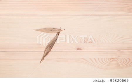 Seven. The number seven is composed of small autumn leaves on a light wooden textured table surface Seven. The number seven is composed of small autumn leaves on a light wooden textured table surface 99320665