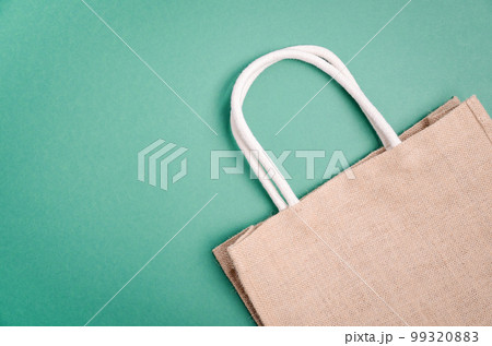 Textile eco friendly shopping bag. Zero waste concept. Plastic free concept. Top view, flat lay, copy space. Textile eco friendly shopping bag. Zero waste concept. Plastic free concept. Top view, flat lay, copy space. 99320883