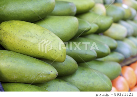 Ripe green mangoes at the fruit market. Harvest of exotic sweet mangoes and fruits. Ripe green mangoes at the fruit market. Harvest of exotic sweet mangoes and fruits. 99321323