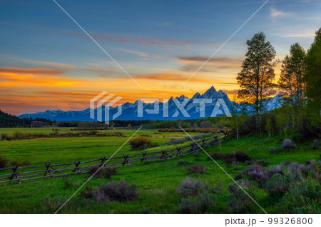 Colorful sunset above the Grand Teton mountains in Wyoming 99326800