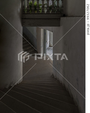 Old cement staircase and wall Interior an abandoned the old residential house building was left to deteriorate over time. Old cement staircase and wall Interior an abandoned the old residential house building was left to deteriorate over time. 99327062