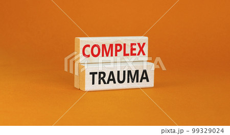 Complex trauma symbol. Concept words Complex trauma on wooden block. Beautiful orange table orange background. Business psychology complex trauma concept. Copy space. 99329024