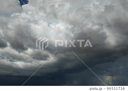 Landscape of dark ominous clouds forming on stormy sky during heavy thunderstorm Landscape of dark ominous clouds forming on stormy sky during heavy thunderstorm 99331716