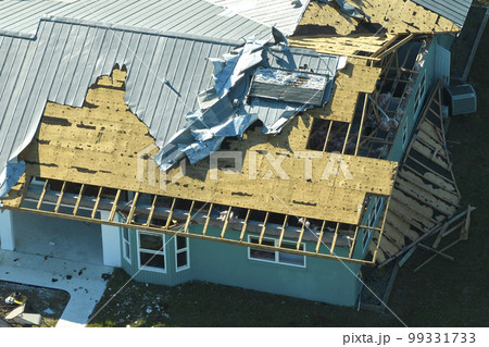 Hurricane Ian destroyed house in Florida residential area. Natural disaster and its consequences 99331733