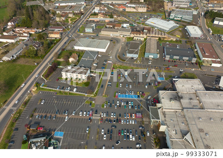 Aerial view of many colorful cars parked on parking lot with lines and markings for parking places and directions 99333071