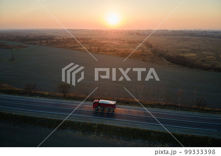 Aerial view of cargo truck driving on highway hauling goods. Delivery transportation and logistics concept 99333398