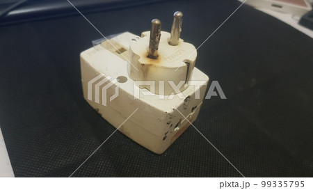 Burnout electrical appliances or electrical plug or electrical adapter dangerous 99335795