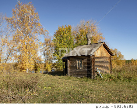 A small wooden church in the Siberian village of Umreva in autumn A small wooden church in the Siberian village of Umreva in autumn 99336292