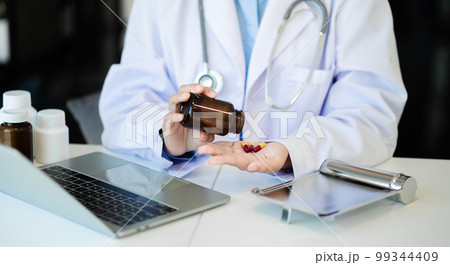 Doctor consulting with patient discussing something and Presenting results on report, healthcare and medical concept. 99344409