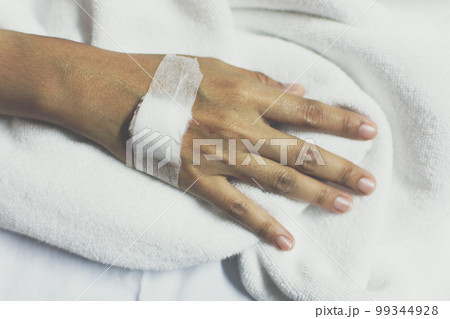 Patient with saline intravenous in the hospital 99344928