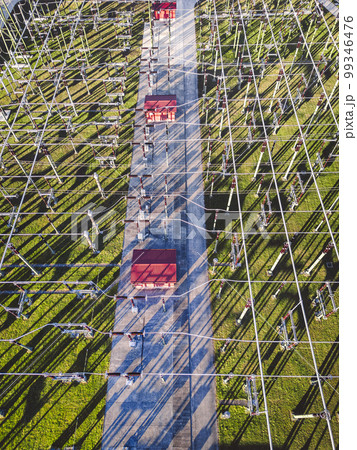 Top down view of electrical wires running around at the electrical substation  99346476