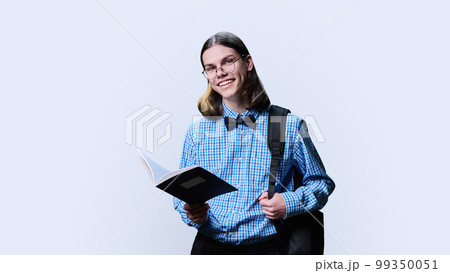Portrait of young male college student, with notebook in hands on white background Portrait of young male college student, with notebook in hands on white background 99350051