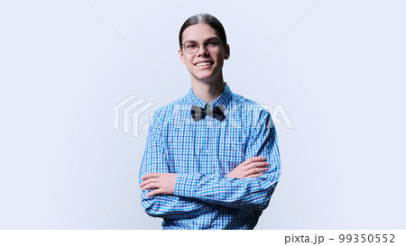 Portrait of confident young male student on white studio background 99350552