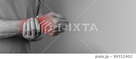 Banner with man suffering from wrist pain and holding painful hand with red spot closeup. Hand injury. Health care, medicine concept. Space for text 99352402