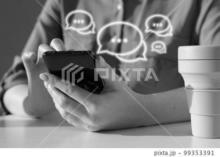 Woman using phone for sending messages. Online social communication concept. Female sitting at table with takeaway cup and chatting, sharing information. Black and white Woman using phone for sending messages. Online social communication concept. Female sitting at table with takeaway cup and chatting, sharing information. Black and white 99353391