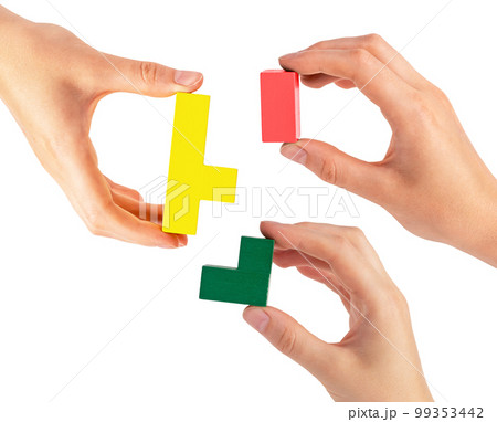 Hands joining puzzle pieces isolated on white background. Teamwork, partnership concept. Help and support among colleagues, teambuilding. 99353442